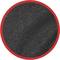 Czarny materiał strukturalny w czerwonej ramce kołowej, prawdopodobnie asfalt lub granulat gumowy.