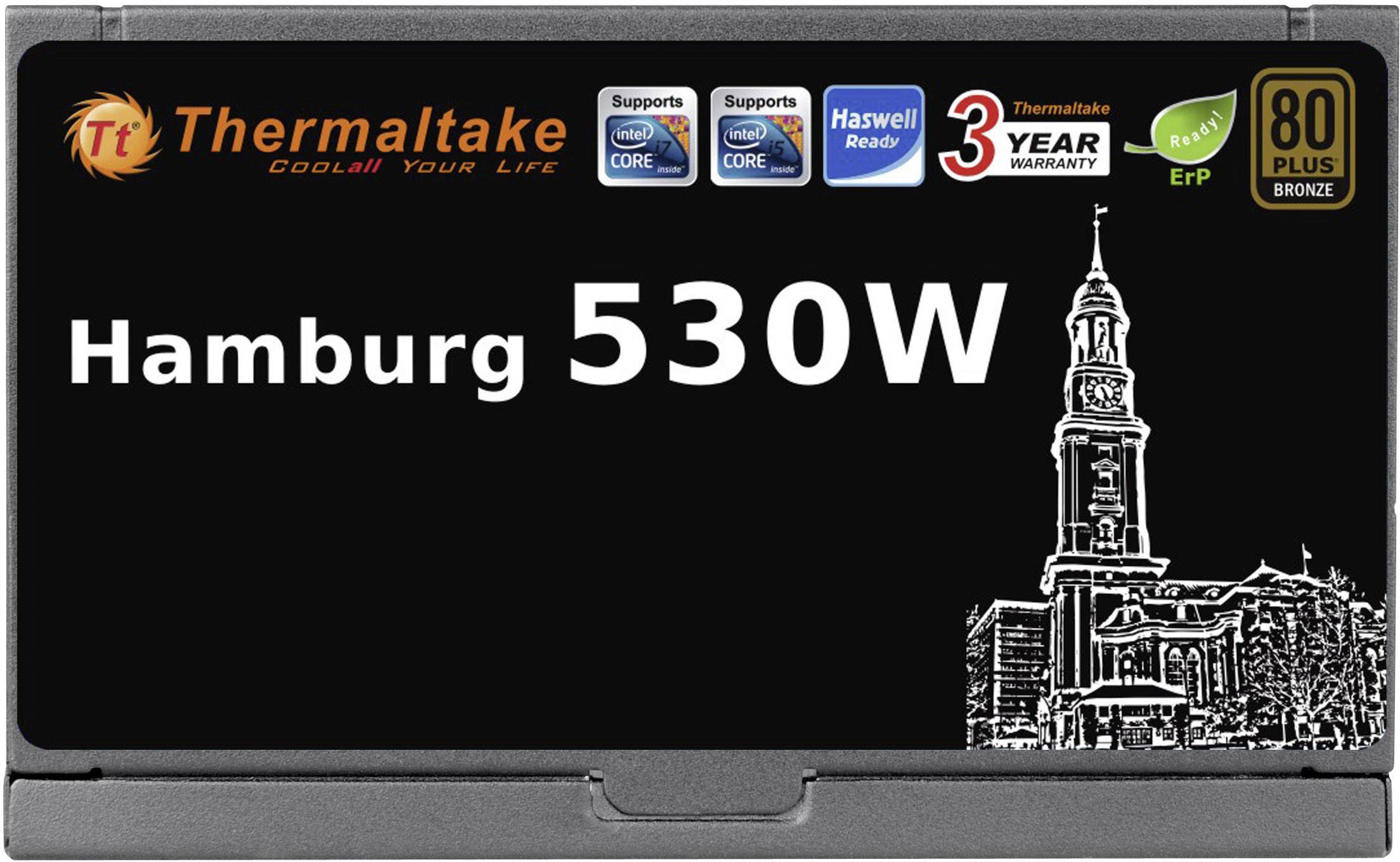 Zdjęcie przedstawia opakowanie zasilacza Thermaltake Hamburg 530W z wizerunkiem hamburskiego kościoła oraz ikonkami informującymi o kompatybilności i gwarancji.