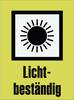 Czarna słońce z promieniami w kwadracie na żółtym tle, poniżej tekst 'Odporny na światło'.