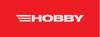 Czerwony obraz z dużym, białym słowem 'HOBBY' pośrodku, z trzema białymi, poziomymi paskami po lewej stronie.