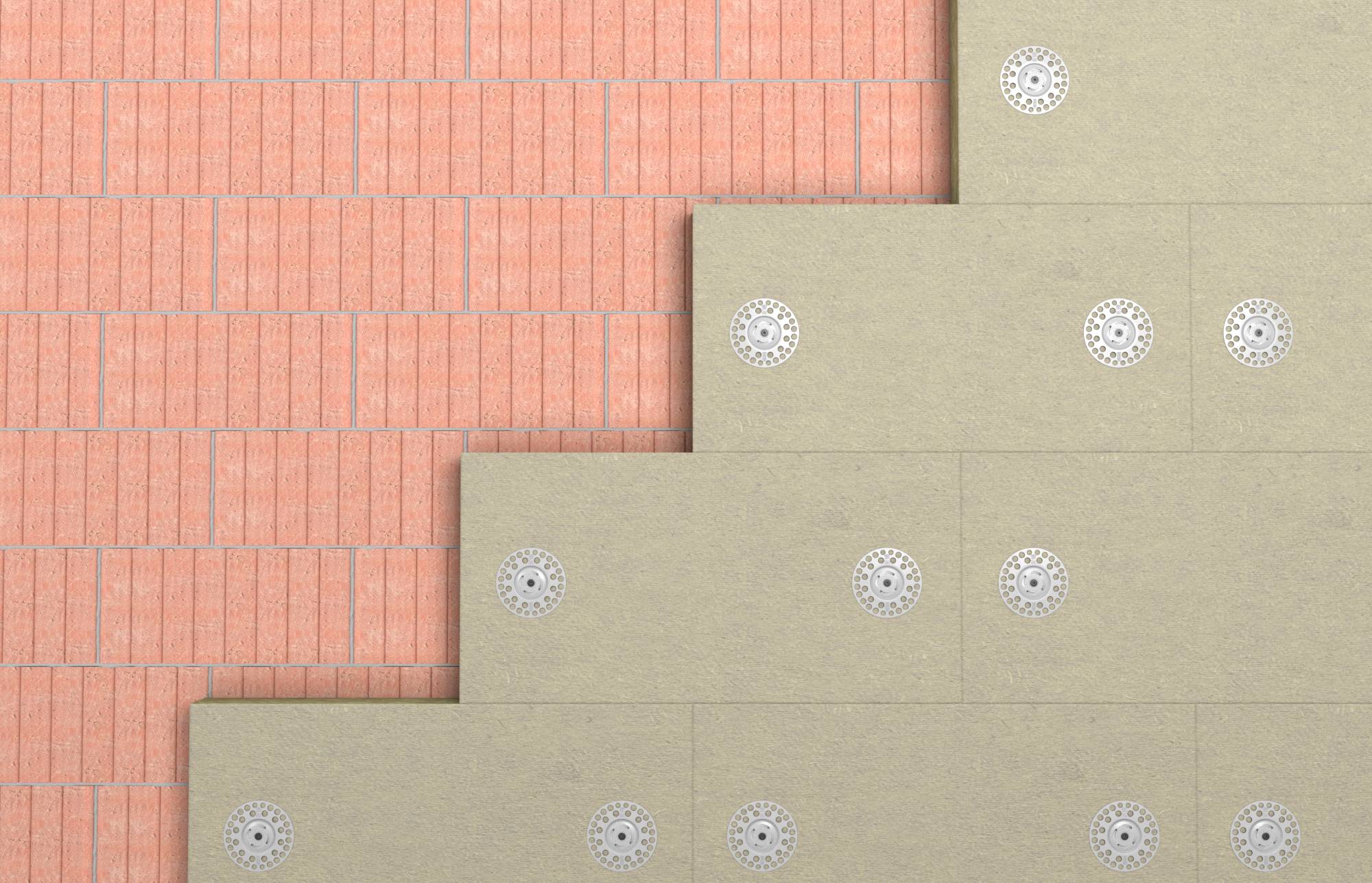 Detailný zábľad na vrstvené stavebné materiály fasády budovy: ružový klinker vľavo a béžové betónové panely vpravo, každý upevnený okrúhlymi spojovacími prvkami.