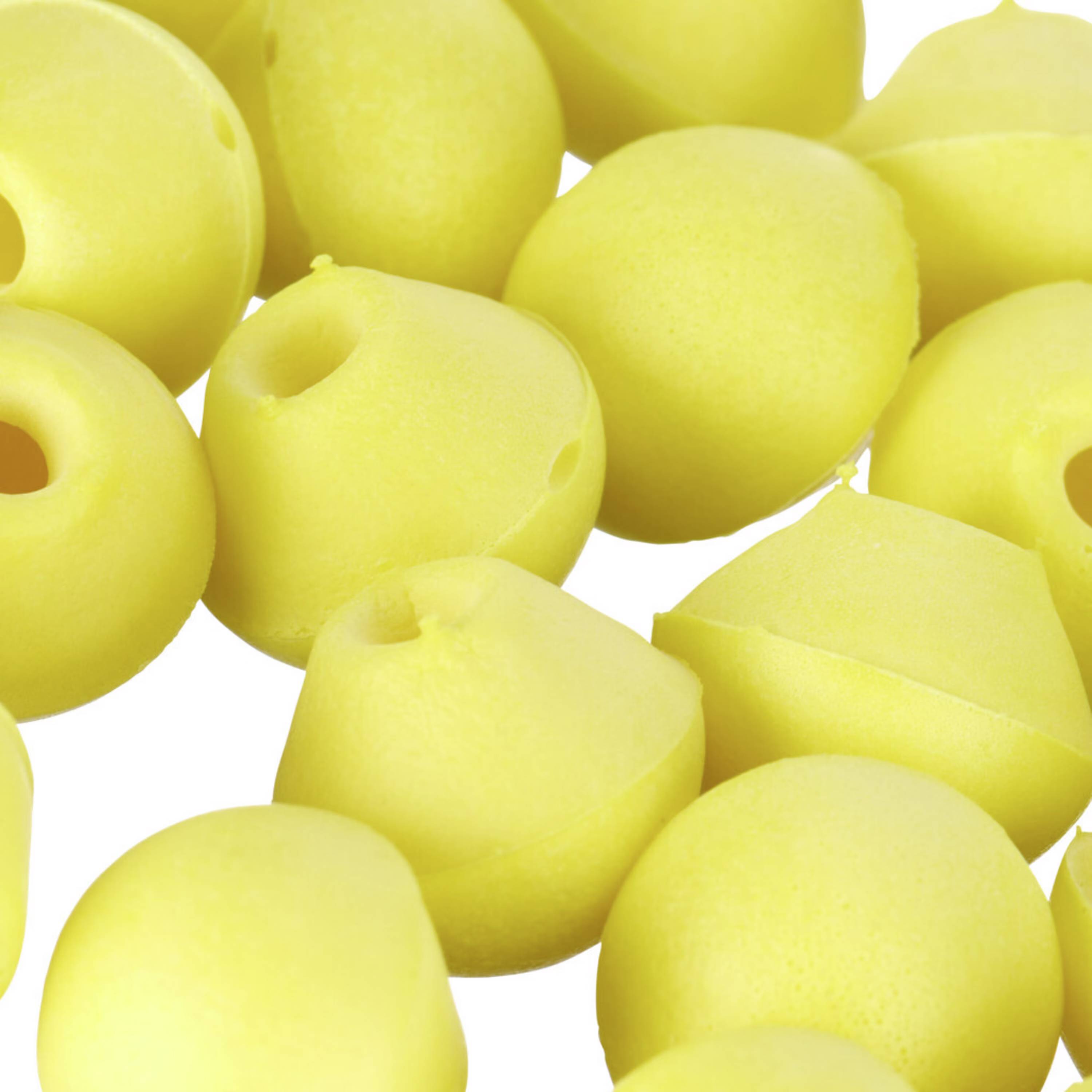 Niekoľko žltých penovkových trsov v detailnom zábere bez rozpoznateľného usporiadania alebo funkcie.