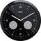 Čierne okrúhle analógové nástenné hodiny zobrazujúce čas ako 10:10, s dvoma dodatočnými malými ciferníkmi pre teplotu a vlhkosť vzduchu pod hlavnými ručičkami.