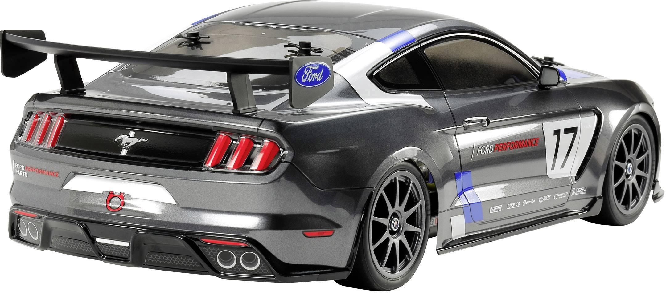 Čierne modelové auto s modrými akcentmi a štartovým číslom '17' na bočnej stene. Zadný spojler, preteková nálepka a logo Ford sú viditeľné.