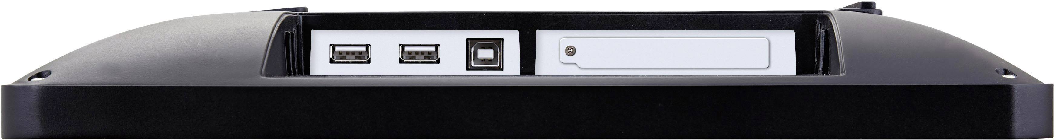 Zadná strana počítača s dvoma USB portami, štvorcovým konektorom a prázdnym obdĺžnikovým poľom.