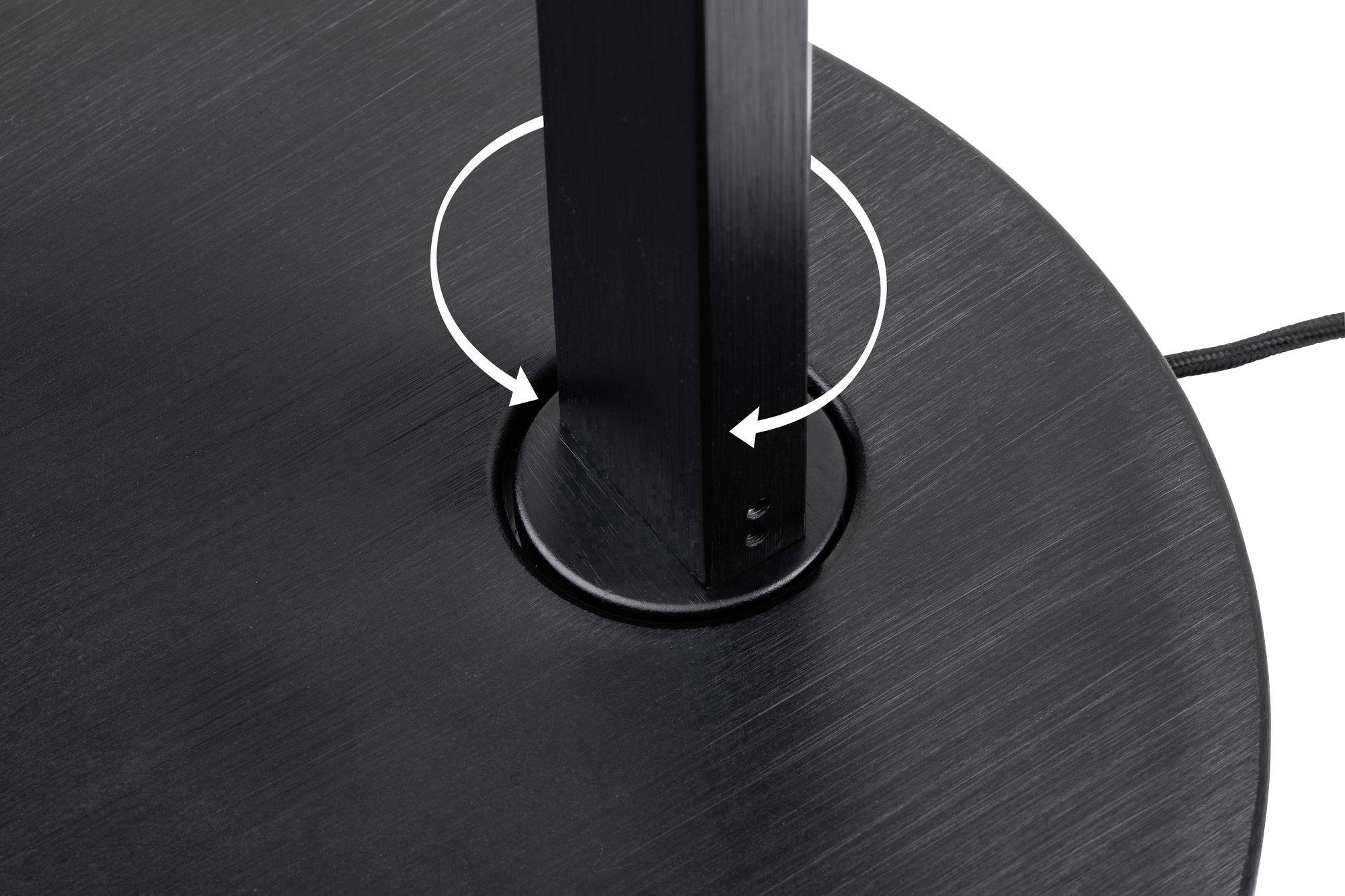 Detailný záber čierneho stojanu so šípkami, ktoré znázorňujú rotačný pohyb okolo vertikálnej osi.