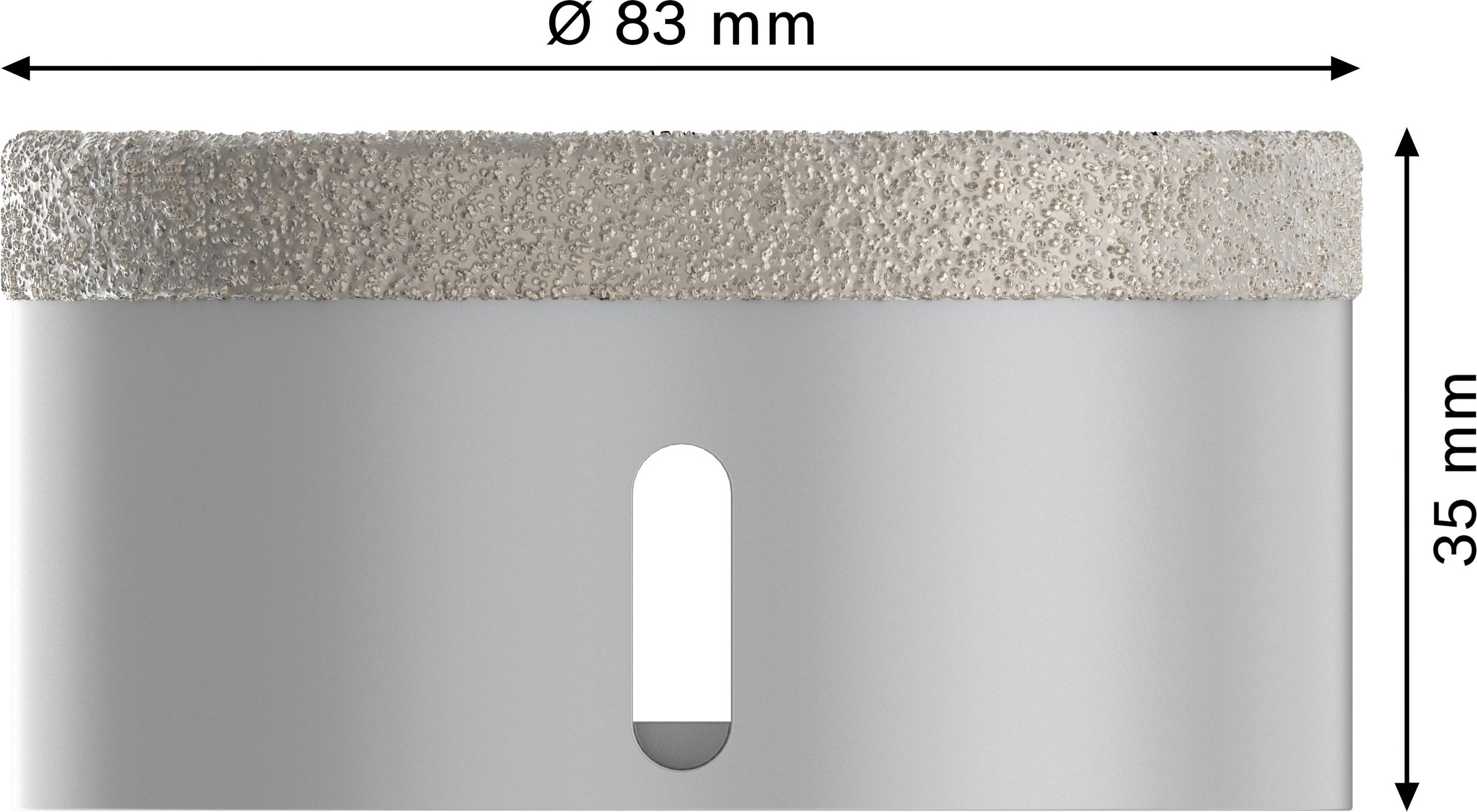 Valcovitý kovový predmet, priemer 83 mm, výška 35 mm, vykazuje bočnú štrbinu a štruktúrovaný horný okraj.