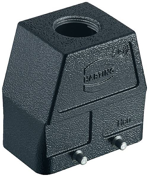 Čierny, robustný kovový blok s valcovitým otvorom na vrchu. Má nápis 'Harting' a malé vertikálne kolíky dole.