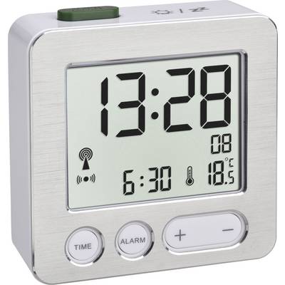 Digitálny budík s veľkým displejom zobrazuje čas 13:28, dátum, čas budenia 6:30 a teplotu 18,5 °C. Obsahuje tlačidlá hodín a budenia.