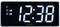Digitálny budík zobrazuje čas 12:38, s aktivovanými alarmami a funkciou odloženia budenia.