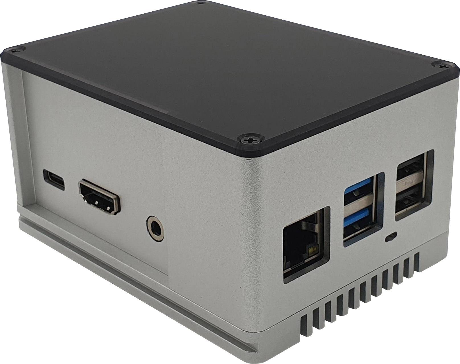 Malý, obdĺžnikový mini počítač v striebornom kryte s niekoľkými portami vrátane USB, HDMI a Ethernet.