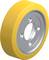 Žlté koleso so strieborným vnútrom a niekoľkými otvormi, pravdepodobne súčasť stroja alebo vozidla.