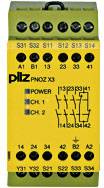 Žlté bezpečnostné relé s čiernym textom a schémami. Značka 'Pilz', model 'PNOZ X3'. Niekoľko pripojení je viditeľných.
