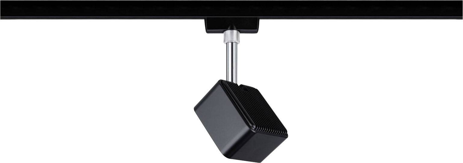 Čierny kocka visí z kovovej tyče pod čiernym povrchom.