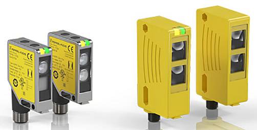 Niekoľko žltých a sivých senzorov, pravdepodobne indukčných senzorov, zoskupených. Vykazujú rôzne tvary krytov a pripojení.
