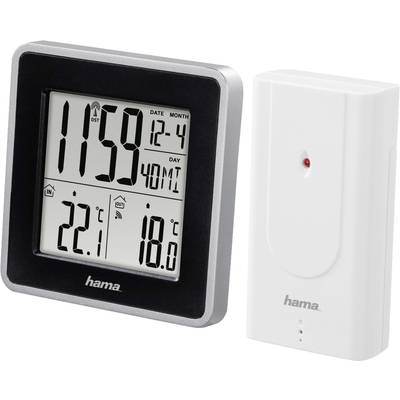 Čierna digitálna meteorologická stanica s displejom zobrazujúcim čas, dátum, vnútornú teplotu (22,1°C) a vonkajšiu teplotu (18,0°C); biely vonkajší snímač.