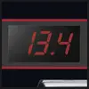 Elektronický displej zobrazuje číslo 13,4 červenými číslicami na čiernom pozadí.
