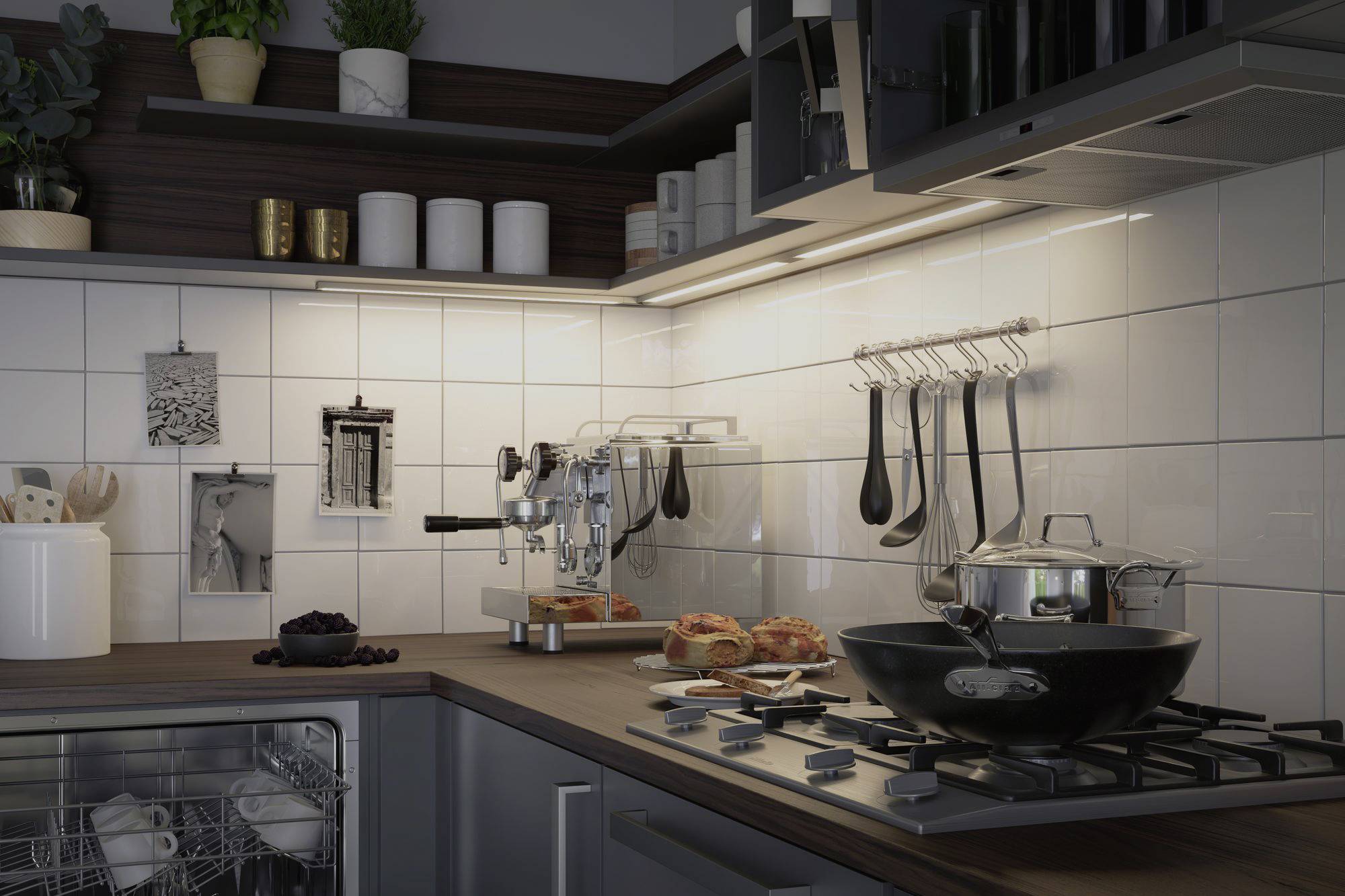 Moderná kuchyňa so svetlými obkladačkami, plynovým sporákom a kuchynskými potrebami. Na pracovnej doske sú umiestnené kávovar, panvica a chlieb.