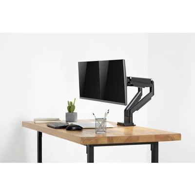 Moderný písací stôl s monitorom na nastaviteľnom ramene, vedľa ktorého sú klávesnica, myš, poznámkový blok, stojan na perá a kaktus.