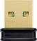 Malý, zlatisto sfarbený USB dongle s čiernou plastovou základňou, primárne používaný na bezdrôtové pripojenia.