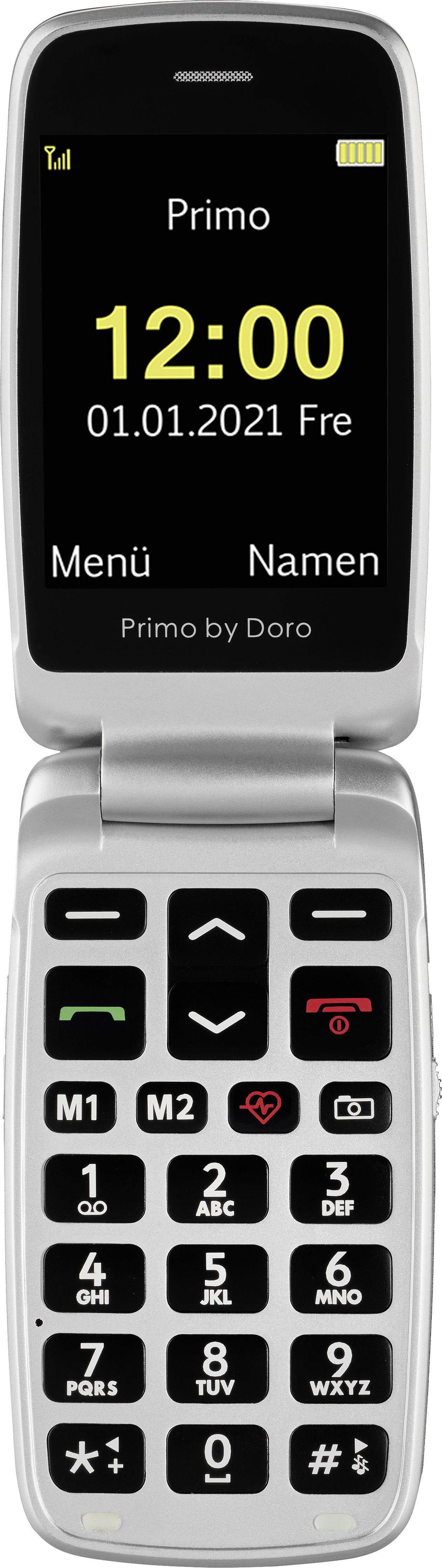 Strieborný skladací mobilný telefón s veľkým displejom. Na obrazovke svieti: '12:00, 01.01.2021, Pia'. Pod ňou sú tlačidlá s veľkými číslami.