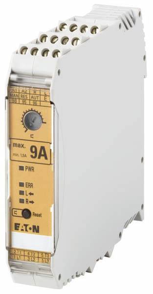 Sivé elektronické zariadenie so žltou etiketou, na ktorej je napísané 'max. 9A', zobrazuje rôzne konektory na vrchu a ciferník.