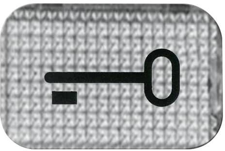 Symbol kľúča na štruktúrovanom povrchu.