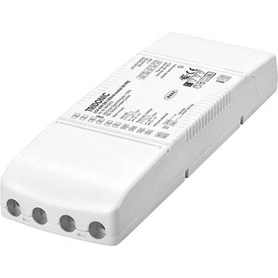 Obrázok zobrazuje obdĺžnikové, biele elektrické zariadenie s viacerými prípojkami a nápismi na povrchu. Mohlo by ísť o elektronický predradník alebo transformátor.