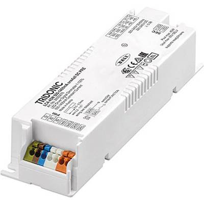 Obdĺžnikové, biele elektronické zariadenie s rôznymi technickými štítkami a konektormi. Nesie logo 'Tridonic'.