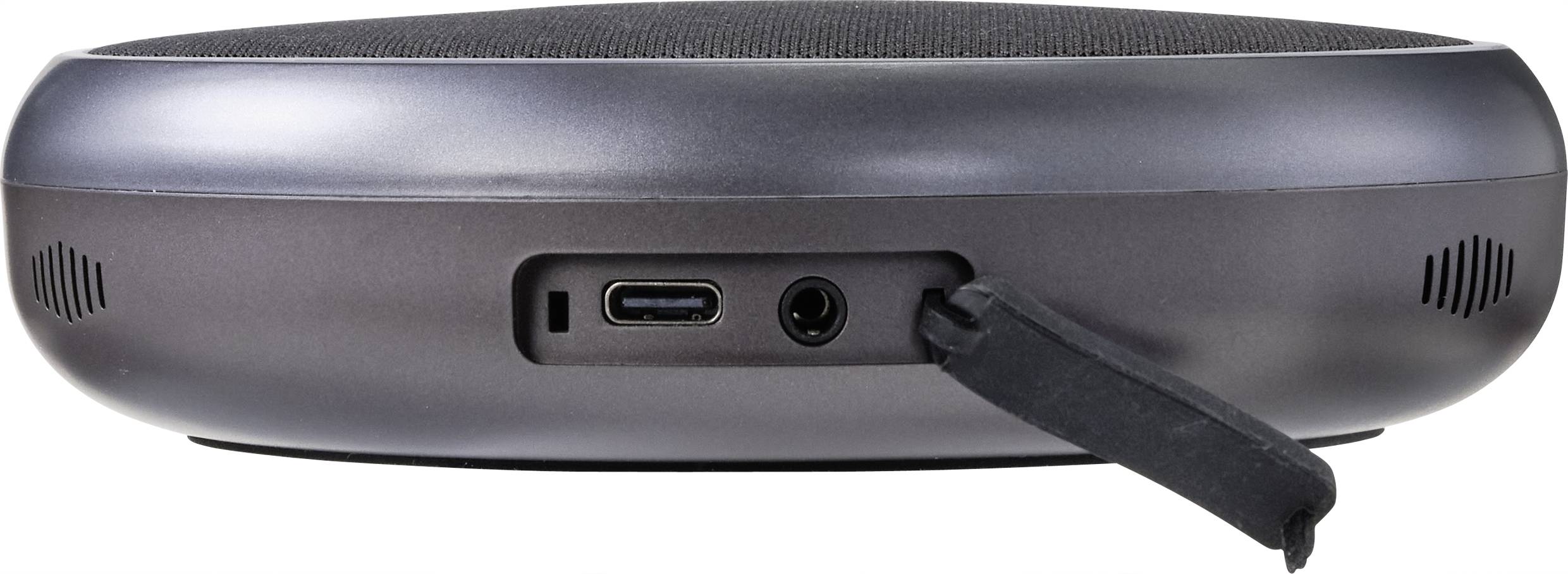 Sivé, okrúhle zariadenie s USB-C portom a audio zásuvkou. Pohľad zozadu. Pravdepodobne určené na prenos audia.