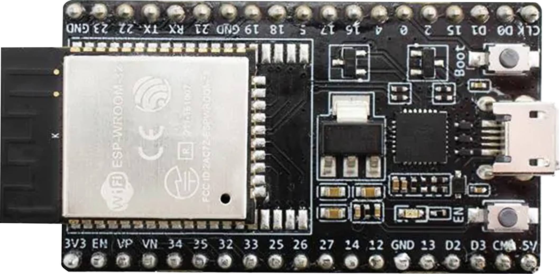Mikroprocesorová doska s modulom ESP-WROOM-32, USB portom a viacerými pinmi pre rôzne vstupné a výstupné funkcie.