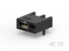 Čierny elektrický konektor so štyrmi kovovými kolíkmi, určený na použitie v elektronických zariadeniach.