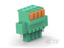 Zelený konektor s piatimi oranžovými tlačidlami pre elektrické pripojenia, namontovaný na bočnej strane bielo-sivého povrchu.