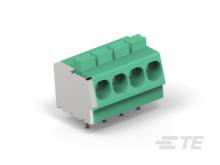 Zelený konektor so štyrmi vývodmi, používaný v elektronických obvodoch na prepojenie káblov a komponentov.
