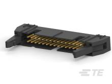 Detailný záber čierneho konektora so zlatými kolíkmi, ktoré sa používajú na elektronické prepojenia.