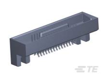 Sivý elektrický konektor s viacerými kovovými pinmi, vhodný na pripojenie elektronických komponentov.