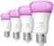 Štyri Philips Hue žiarovky s bielym a farebným svetlom. Žiarovky svietia ružovo. Ideálne pre atmosférickú atmosféru.