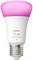 Inteligentná LED lampa značky Philips Hue, model 'white and color 1100', s ružovým svetelným odtieňom na vrchu a štandardným skrutkovým soklom.