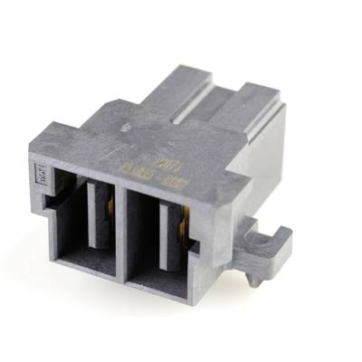 Sivý elektronický konektor s dvoma obdĺžnikovými konektormi a reliéfnymi značkami, používaný pre elektrické prepojenia.