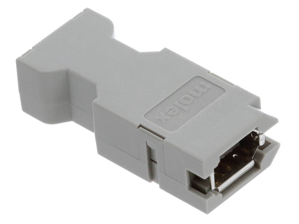 Šedý adaptérový konektor s obdĺžnikovým púzdrom, vhodný pre elektrické prepojenia v technických zariadeniach.