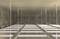 'Oceľové nosné profily uložené v betónovom priestore, fotografované zhora. Sú viditeľné zavesenia a upevnené reťaze.'