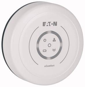 Guľaté biele zariadenie s logom Eaton a nápismi 'xComfort', zobrazujúce symboly energie, konektivity a ovládania.