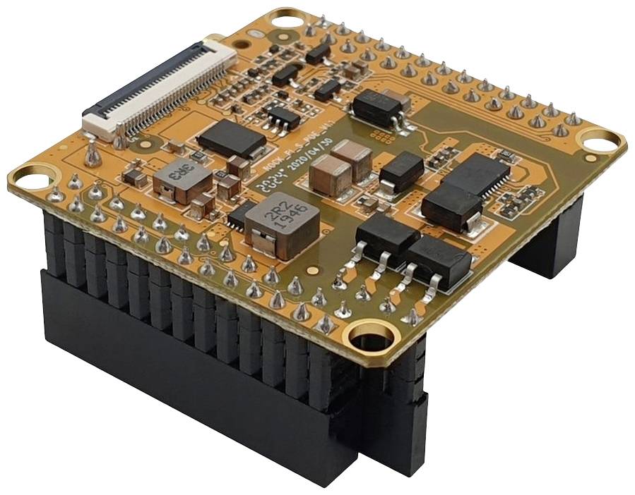 Elektronický modul s početným počtom pinov a konektorom na vrchu, namontovaný na čiernom chladiči.