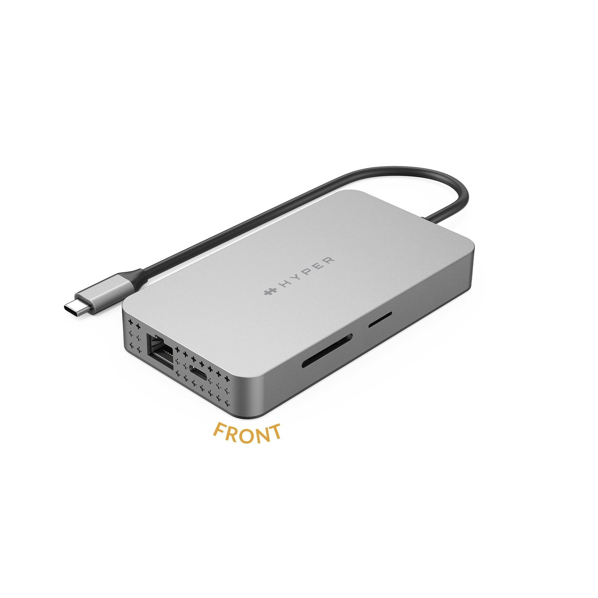 USB-C hub v striebornej farbe s viacerými portami vrátane ethernetového pripojenia, čítačky SD kariet a HDMI. Kábel je pevne pripojený.