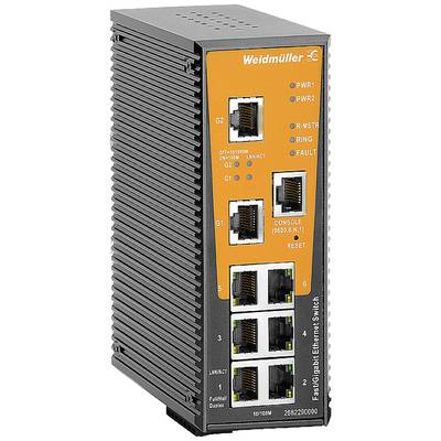 Priemyselný Fast/Gigabit Ethernet switch s viacerými Ethernet portami, stavovými LED indikátormi a oranžovým ovládacím panelom.
