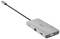 Sivý USB-C hub s viacerými portami vrátane HDMI, VGA, Ethernet a USB-A, prepojený krátkym káblom.