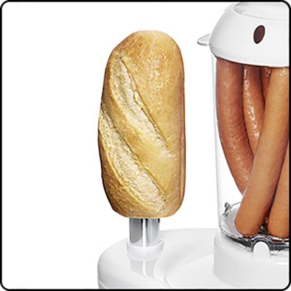 Žemle vedľa stroja s teplými hot dogmi v sklenenej nádobe, pripravené na prípravu.