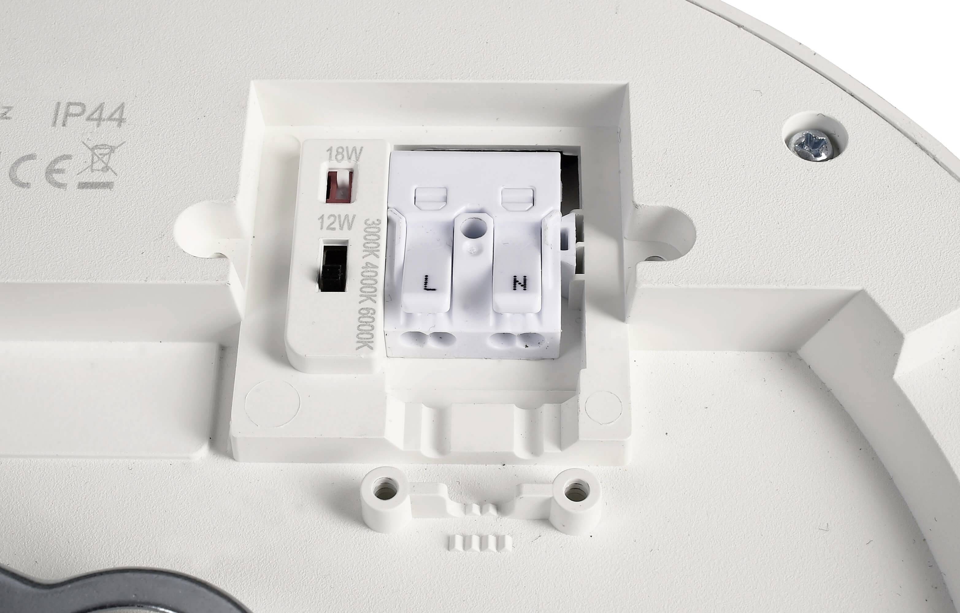 Svorky 'L' a 'N' v bielom kryte s označením pre nastavenie 18W alebo 12W.