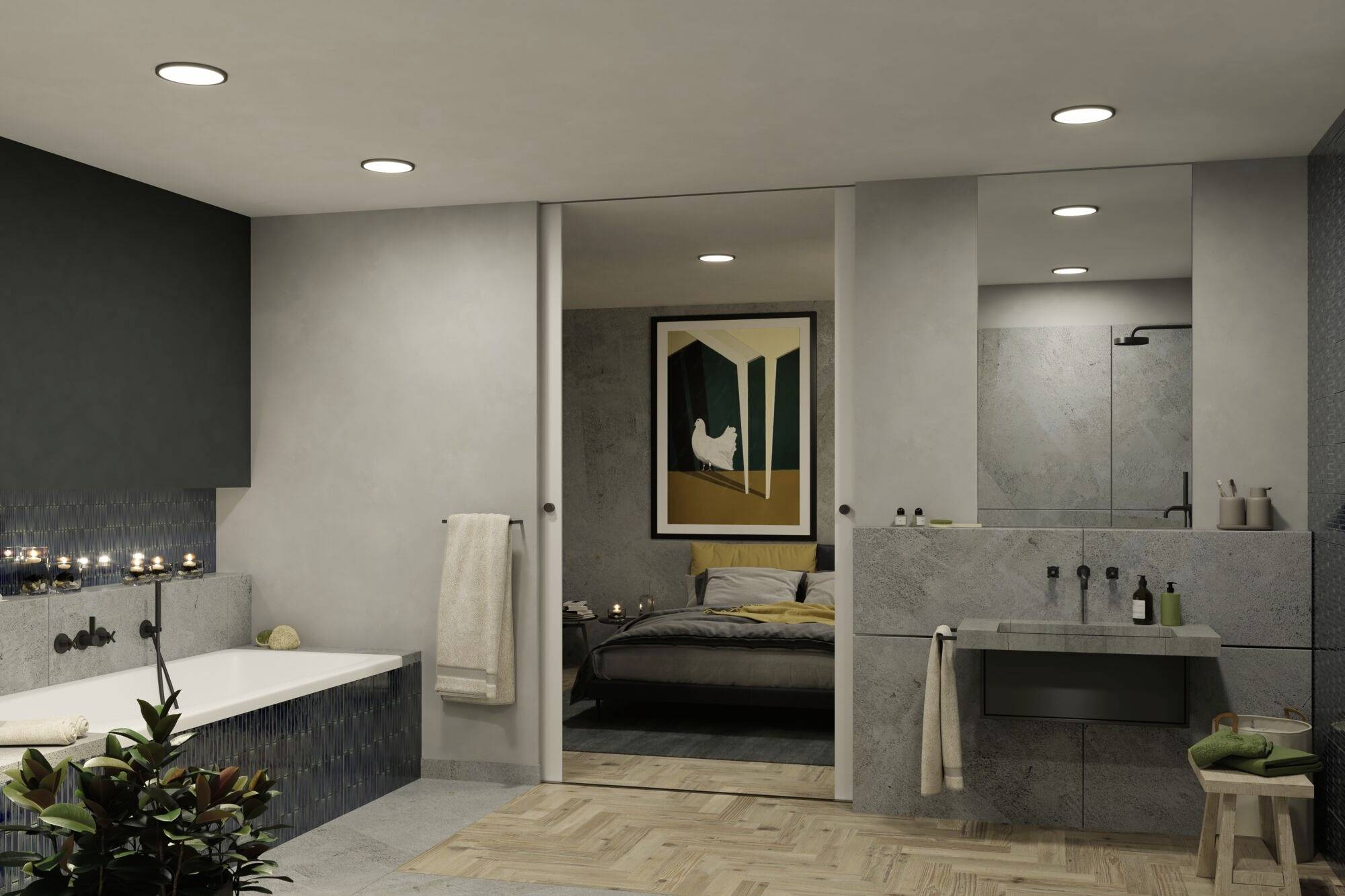 Moderná kúpeľňa s vaňou, rastlinami a uterákmi; v pozadí spálňa s obrazom na stene.