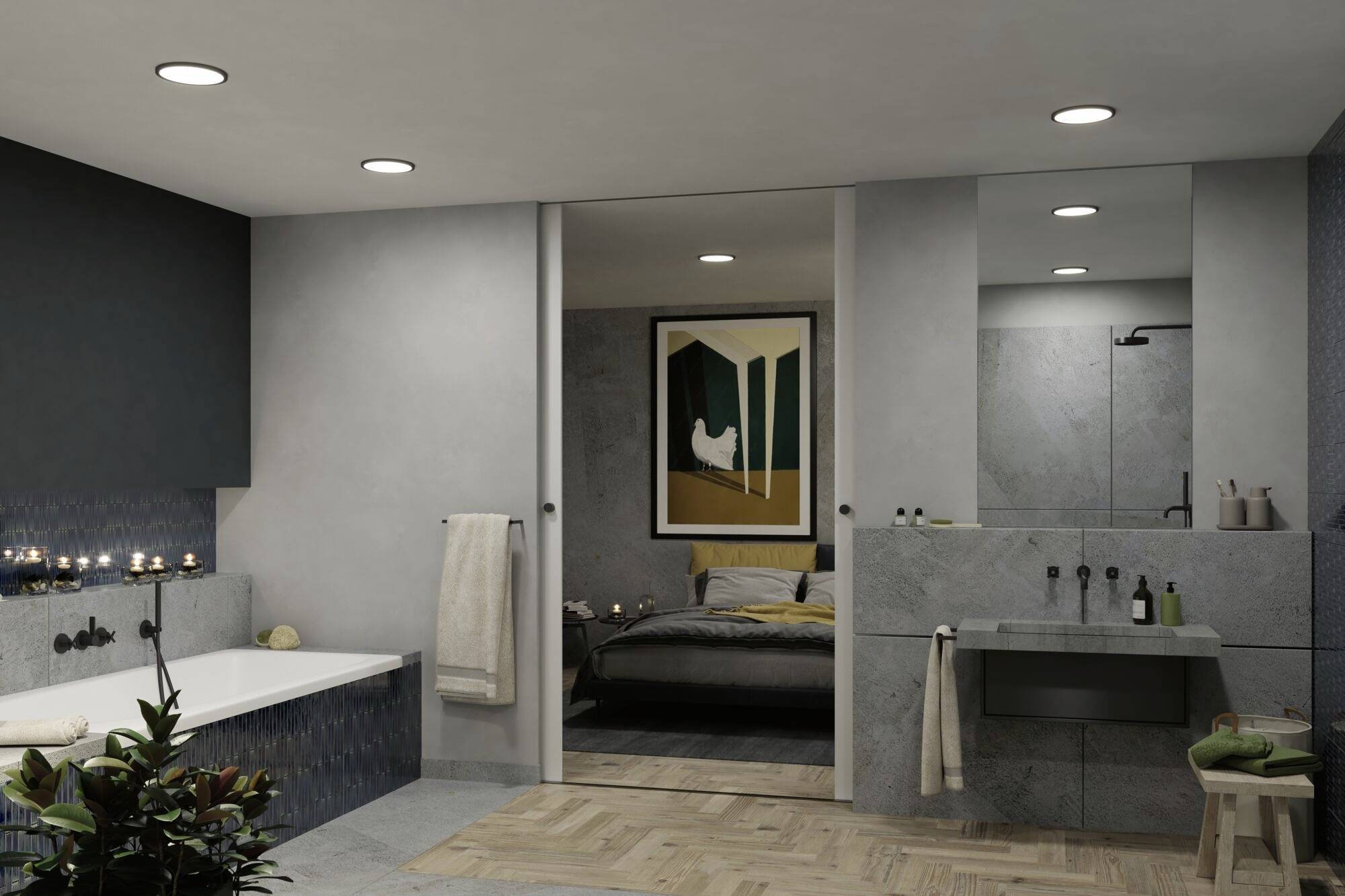 Moderná kúpeľňa s veľkou vaňou, sivými dlaždicami a nepriamym osvetlením. Cez posuvné dvere výhľad do spálne.